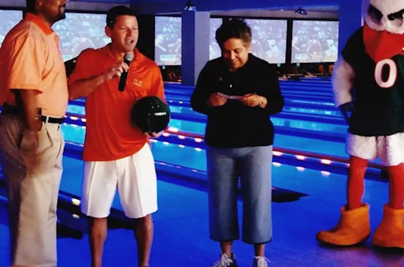 Image: Donna Shalala happily accepting a check from Ponzi schemer Nevin Shapiro.