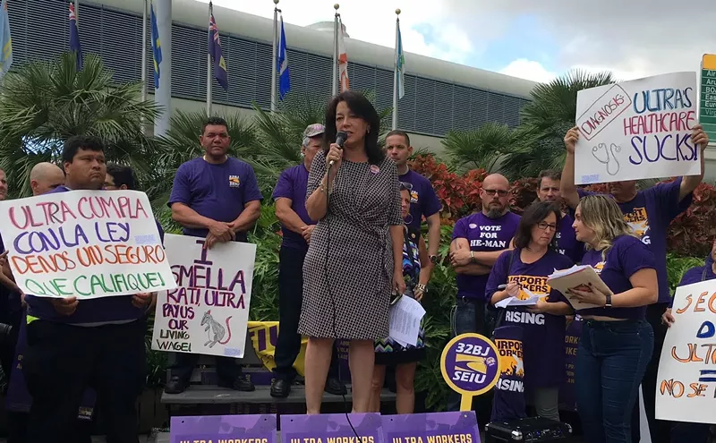 Image: Dozens of Miami International Airport Workers Strike Just Before July 4th Weekend