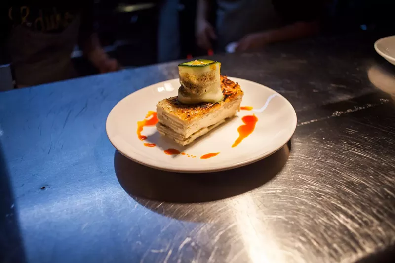 Image: The smoked greens: Zucchini stuffed with smoked vegetables, herbs, and cheese crowns a potato cake.