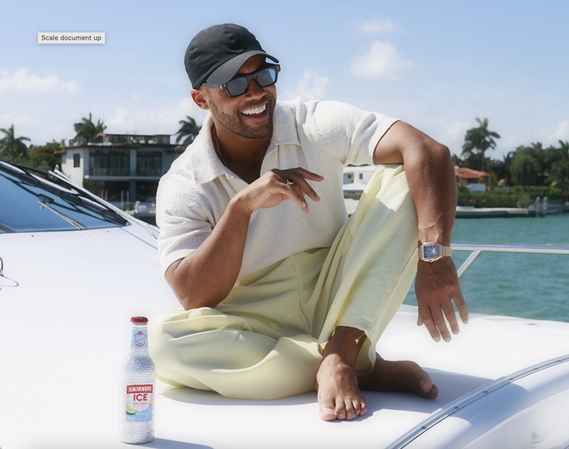 Image: A man smiling on a boat with a hat