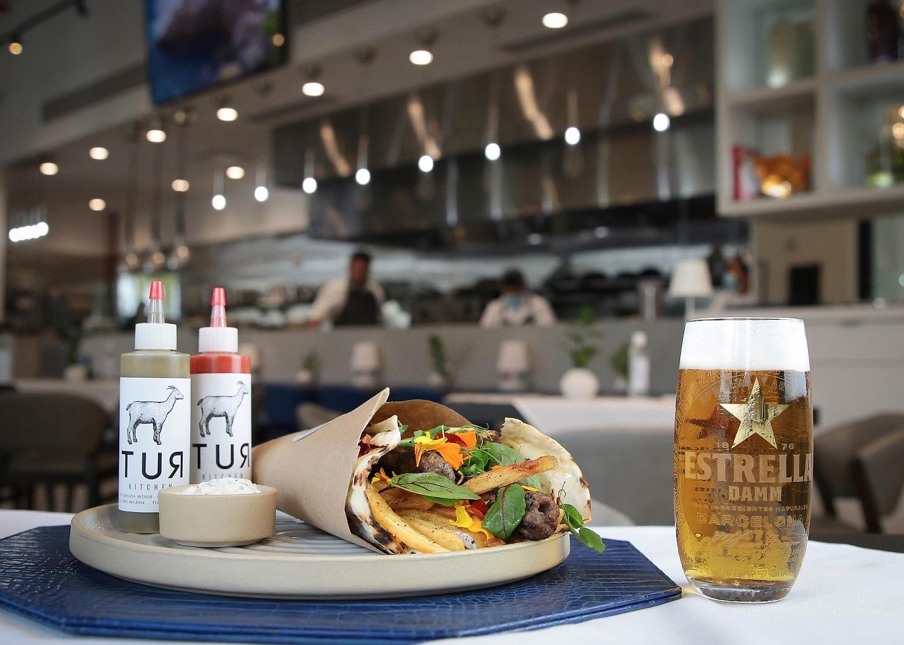 Tur Kitchen's pairing features an Estrella Damm beer served with the Damm Burger for $25.