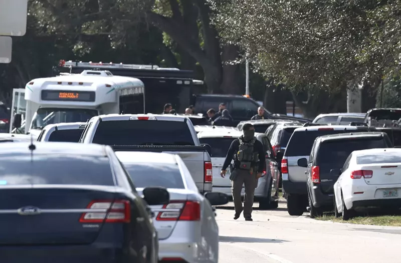 Image: Law enforcement blocked off the area near a Sunrise apartment complex where two FBI agents were killed Tuesday.