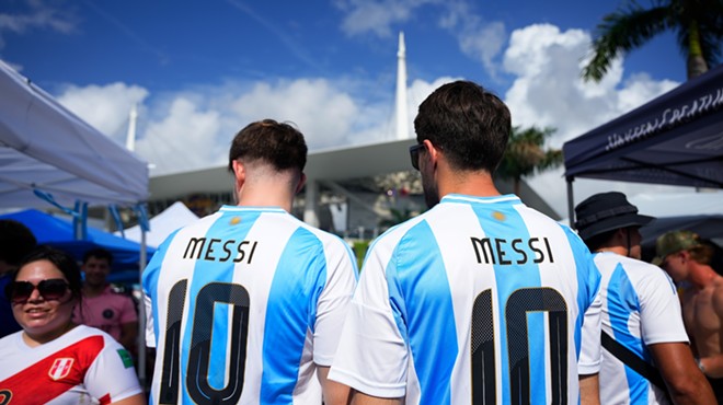 Two Argentina fans wearing Messi jerseys