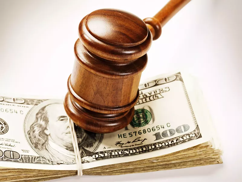 Image: Gavel on top of a stack of money
