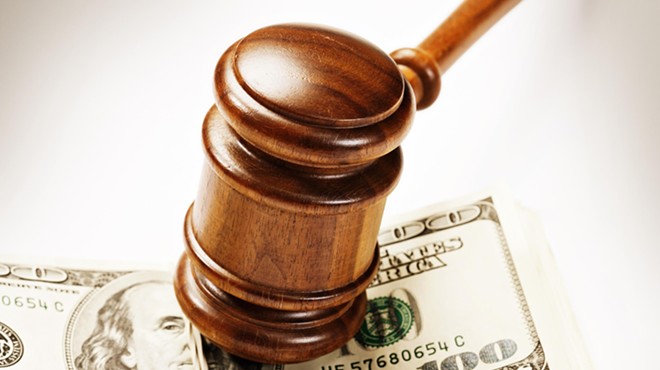 Gavel on top of a stack of money