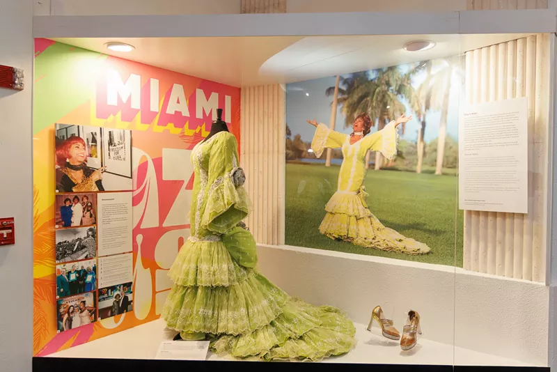 Image: Celia Cruz's famous lime green Cuba dress is on display at the Tower Theater.