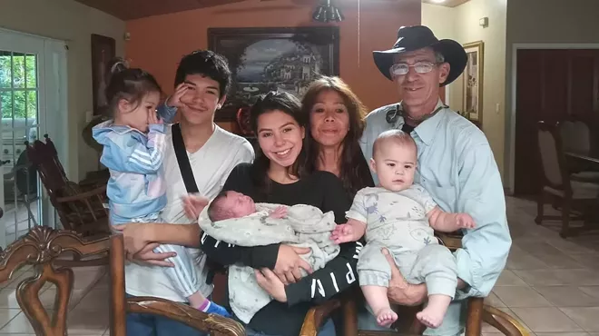 The Cueli family poses for a photo