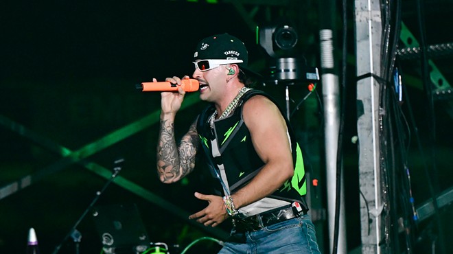 Feid performing on stage at Hard Rock Stadium