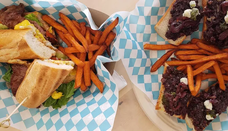 Image: The sandwich el fierro ($14.90) and the bruschetta de morcilla ($10.75)
