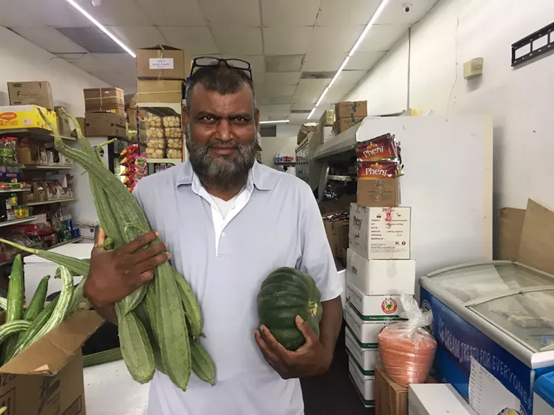 Image: Khan shows off his wares.