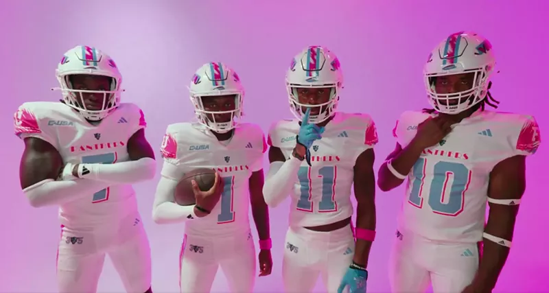 Image: Four FIU football players wearing white Miami Vice-themed jerseys with pink and aqua accents, posing against a bright pink background