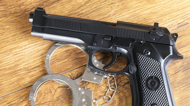 Stock photo of a gun and handcuffs