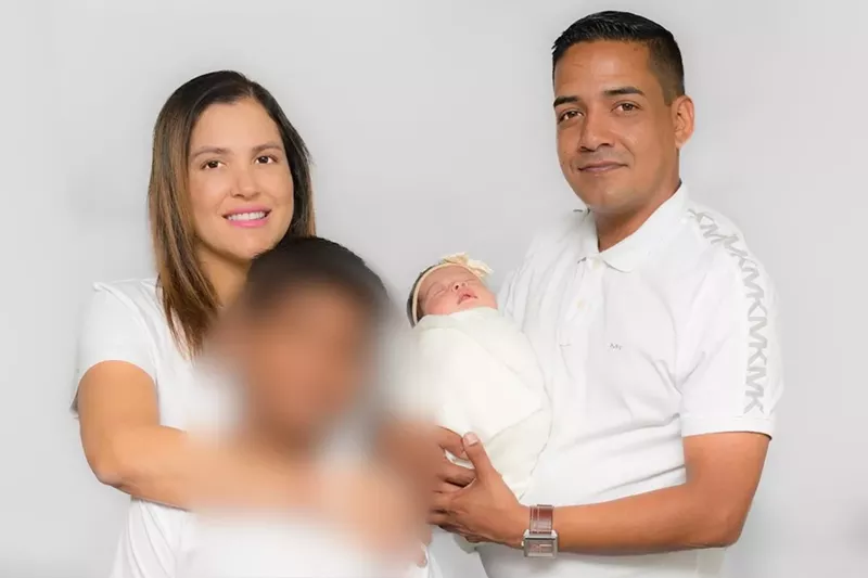 Image: A photo of Yury Ussa Polania, her husband, her son, and her baby.