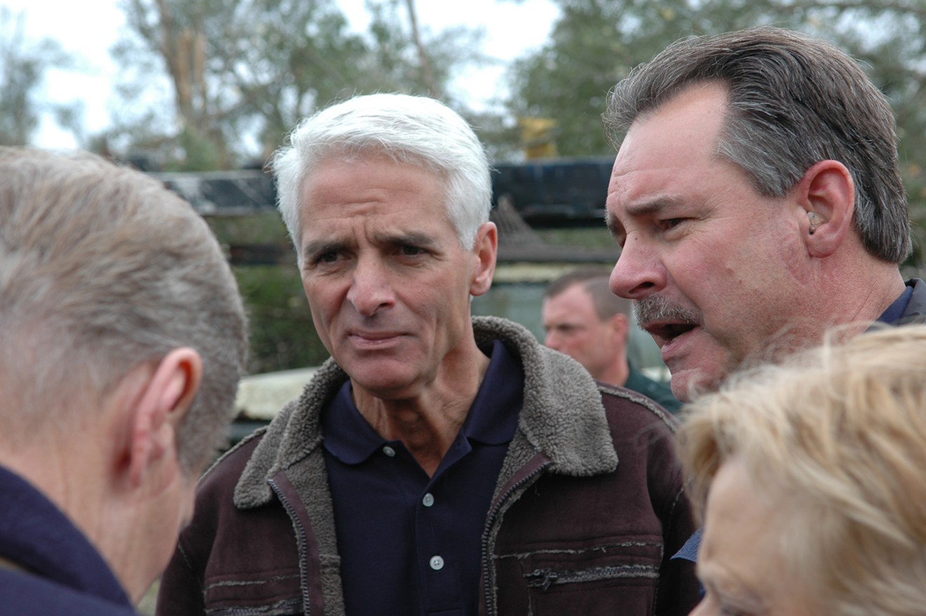 Charlie Crist (center) attemps to understand how hurricanes work.