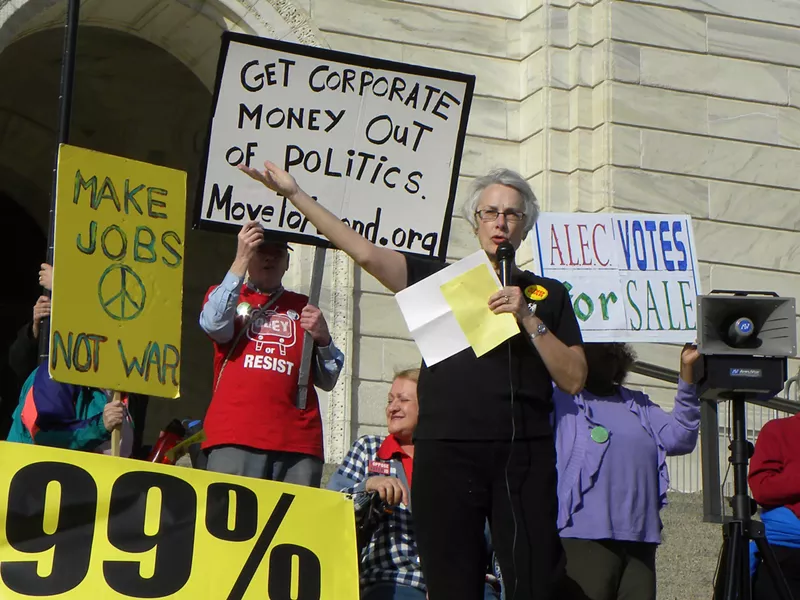 Image: A 2012 protest against ALEC, the American Legislative Exchange Council.