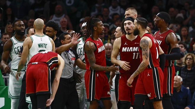 Tension builds on the court as Miami Heat and Boston Celtics exchange words after a hard foul