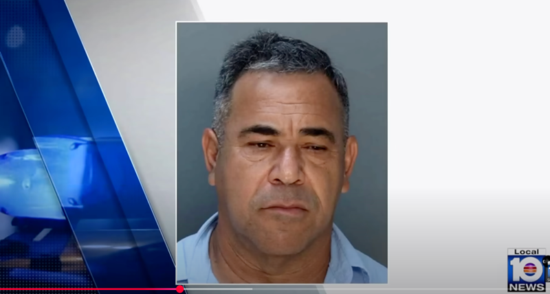 Image: A mugshot of a man in a light blue polo