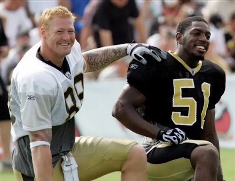 Image: UM greats Jonathan Vilma (right) and Jeremy Shockey during their days playing for the Saints.