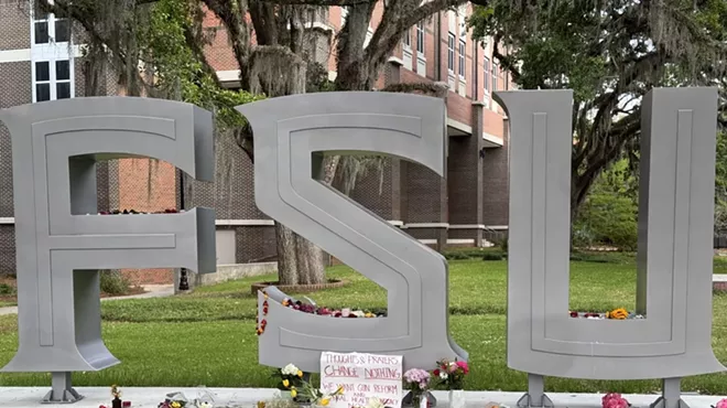 An FSU sign with a message affixed to it which reads, "Thoughts and prayers change nothing. We want gun reform!"
