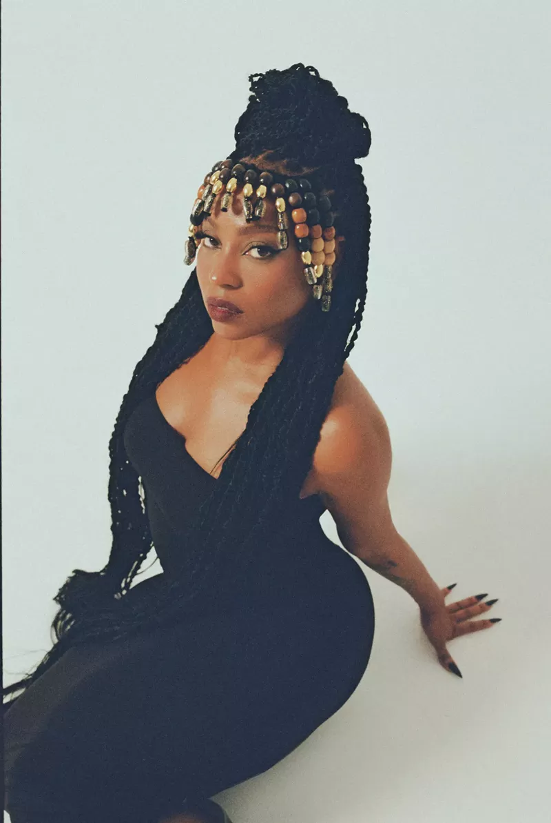 Image: Portrait of a black woman wearing a golden crown