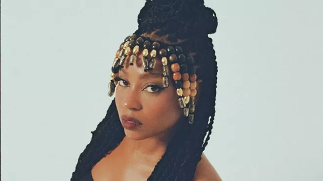 Portrait of a black woman wearing a golden crown