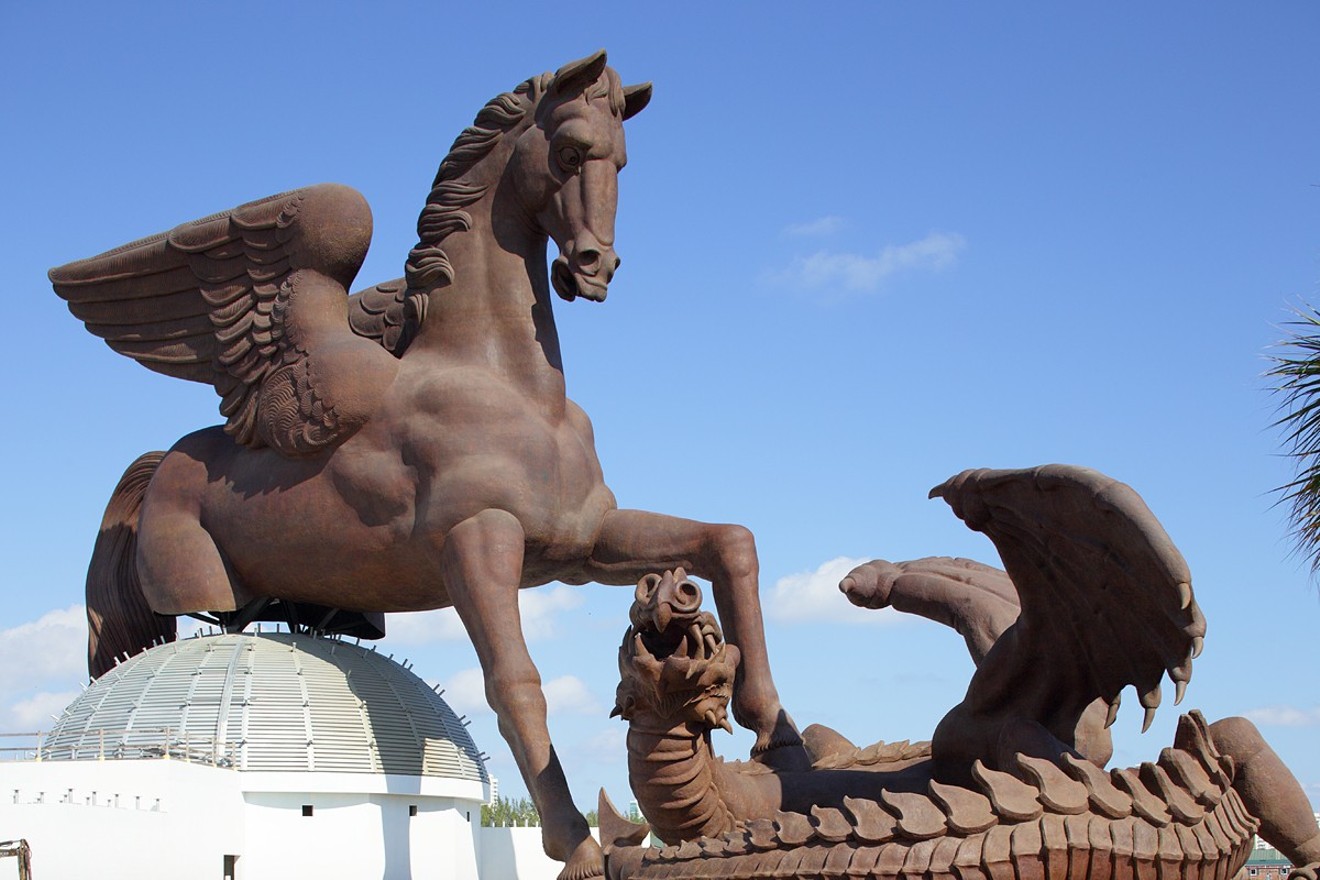 Pegasus stomps a dragon in this colossal sculpture at Gulfstream Park.