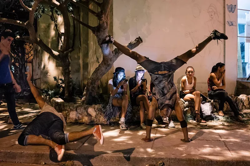 Image: Break dancers warm up for an exhibition dance battle in front of Catedral del Picadillo, a multipurpose center in the Havana neighborhood of Jaimanitas. See more photos from photographer Greg Kahn's book, Havana Youth.