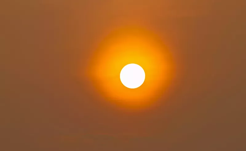 Image: Large orange sun in the sky