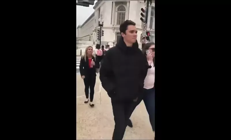 Image: Marjorie Taylor Greene trails Parkland survivor and activist David Hogg in Washington, D.C., in 2018.