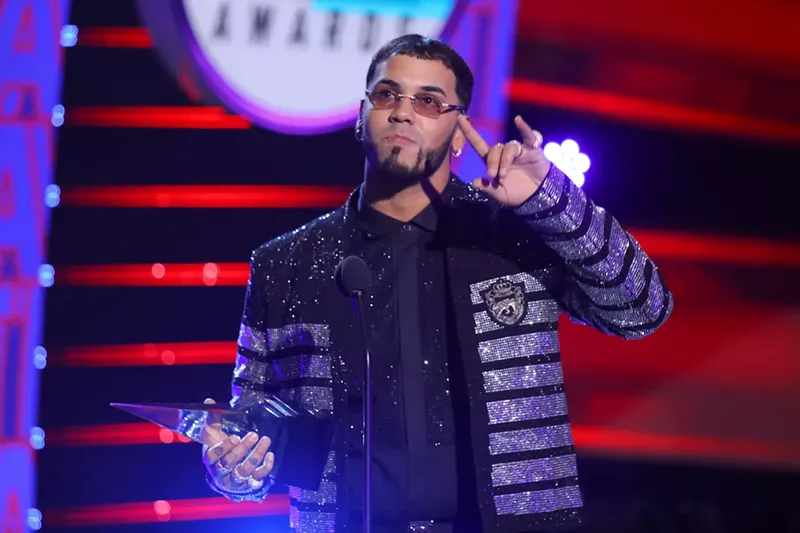 Image: Anuel AA accepting his Artist of the Year trophy at the 2019 Latin American Music Awards.