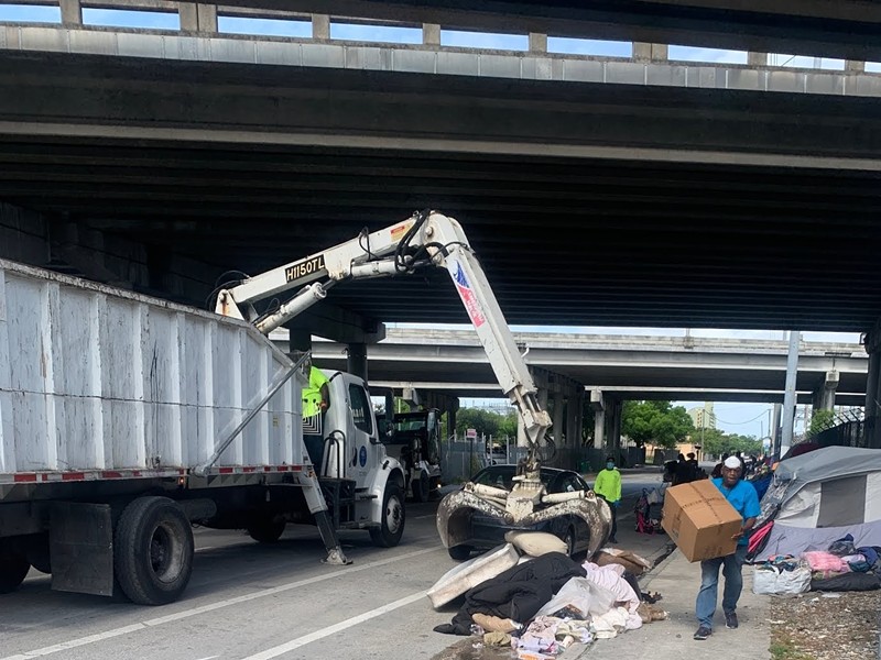 City of Miami workers at the site of a homeless encampment in Overtown on the morning of May 13, 2020