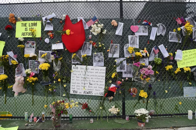 Image: A memorial wall for the people lost at Champlain Towers.
