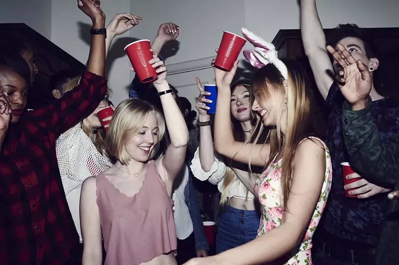 Image: stock photo of group of friends with red Solo cups at a party