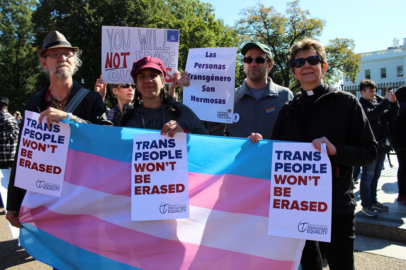 Supporters of the National Center for Transgender Equality march in front of the White House in October 2018