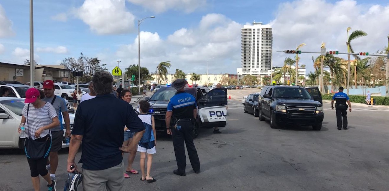 Police stop cars trying to cross the 79th Street Causeway.