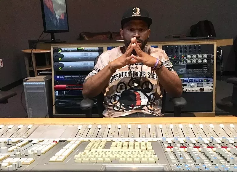 Image: Anthony Blackman, president of Circle of Entertainment, in the studio working on the Community Development Music Conference.
