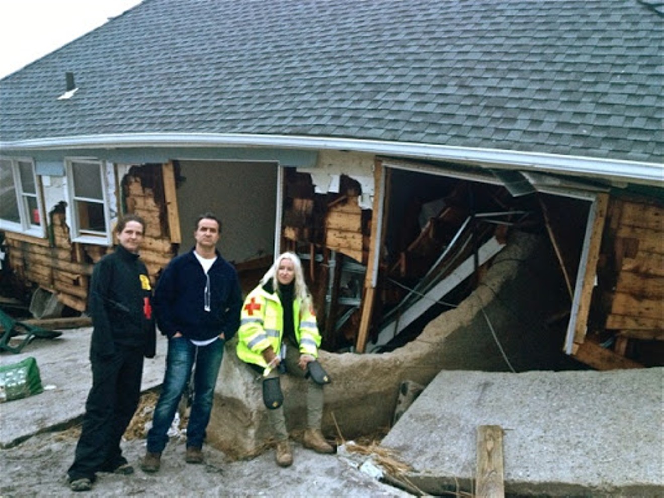 Two volunteers from COH Florida with Alison Thompson after Hurricane Sandy in New Jersey, 2012.