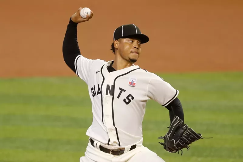 Image: Marlins pitcher Elieser Hernandez wears a uniform commemorating Miami's Negro Leagues team, the Giants, at Marlins Park on Sunday.