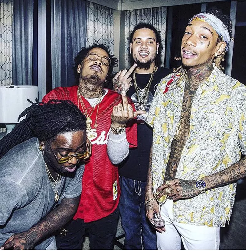 Image: Harrison Garcia (back) partied with some of the biggest names in hip-hop, including Wiz Khalifa (right). See more photos from Harrison Garcia's purple drank empire.