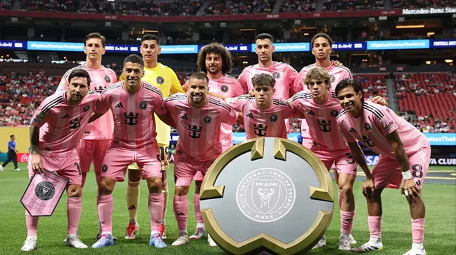A Miami soccer team poses for a pre-game photo.