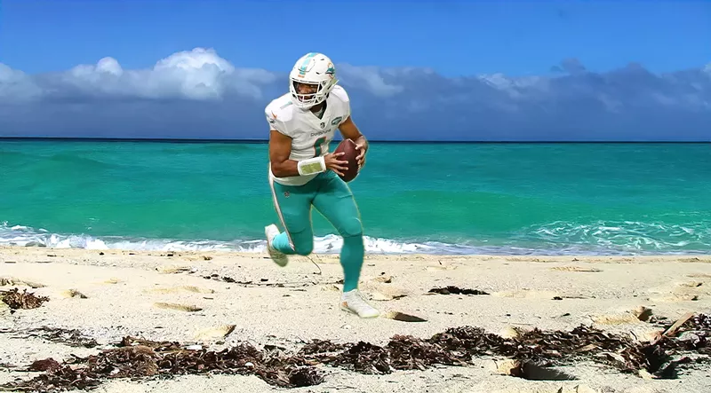 Image: photo-illustration depicting Miami Dolphins quarterback Tua Tagovailoa, in full game uniform, dropping back for a pass on a beach.