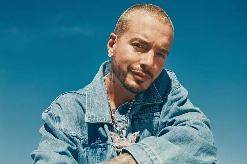 Image: Portrait of a man posing wearing a denim jacket