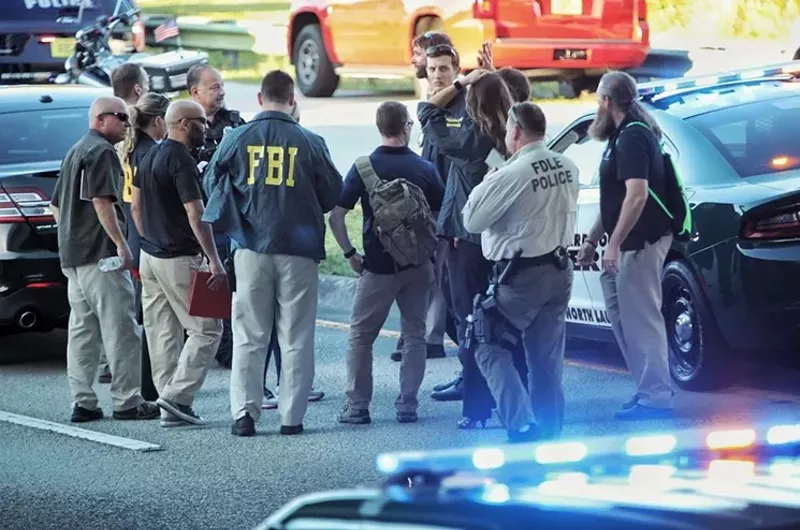 Image: Authorities outside Marjory Stoneman Douglas High after the murders allegedly committed by Nikolas Cruz