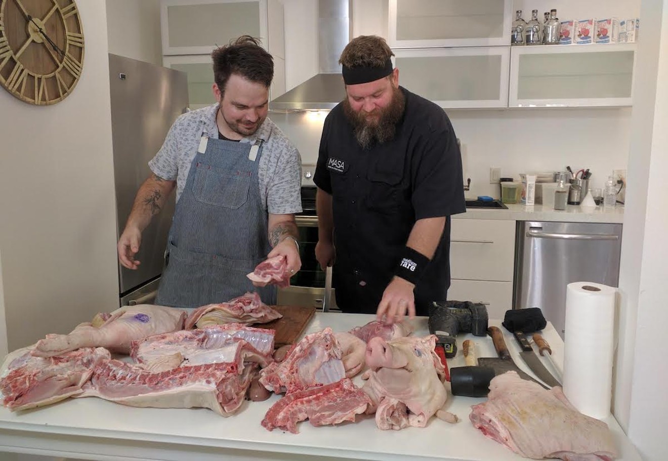 Miami chef Jeremiah Bullfrog (right) looks over pig parts during an episode of his cooking series, Jeremiah Bullfrog Forks It.