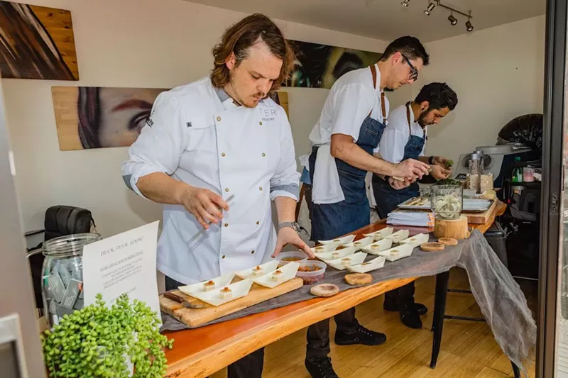 Image: Alter executive chef/owner Brad Kilgore prepares samples at the 2016 Duck Duck Goose.