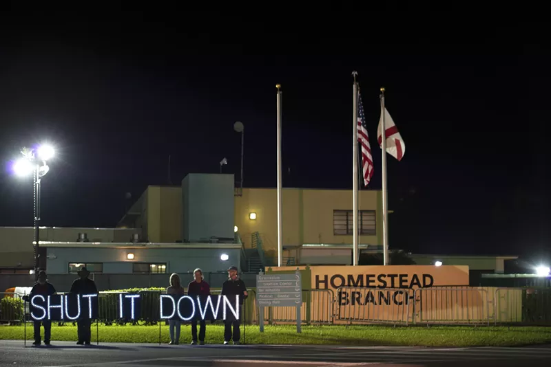 Image: Activists with the group "Witness: Tornillo. Target: Homestead" protest outside the shelter.