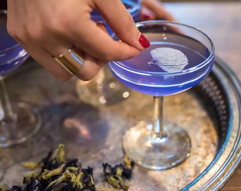 Image: Jules Aron uses butterfly pea tea and aged rum in the CBD cocktail Purple Haze.