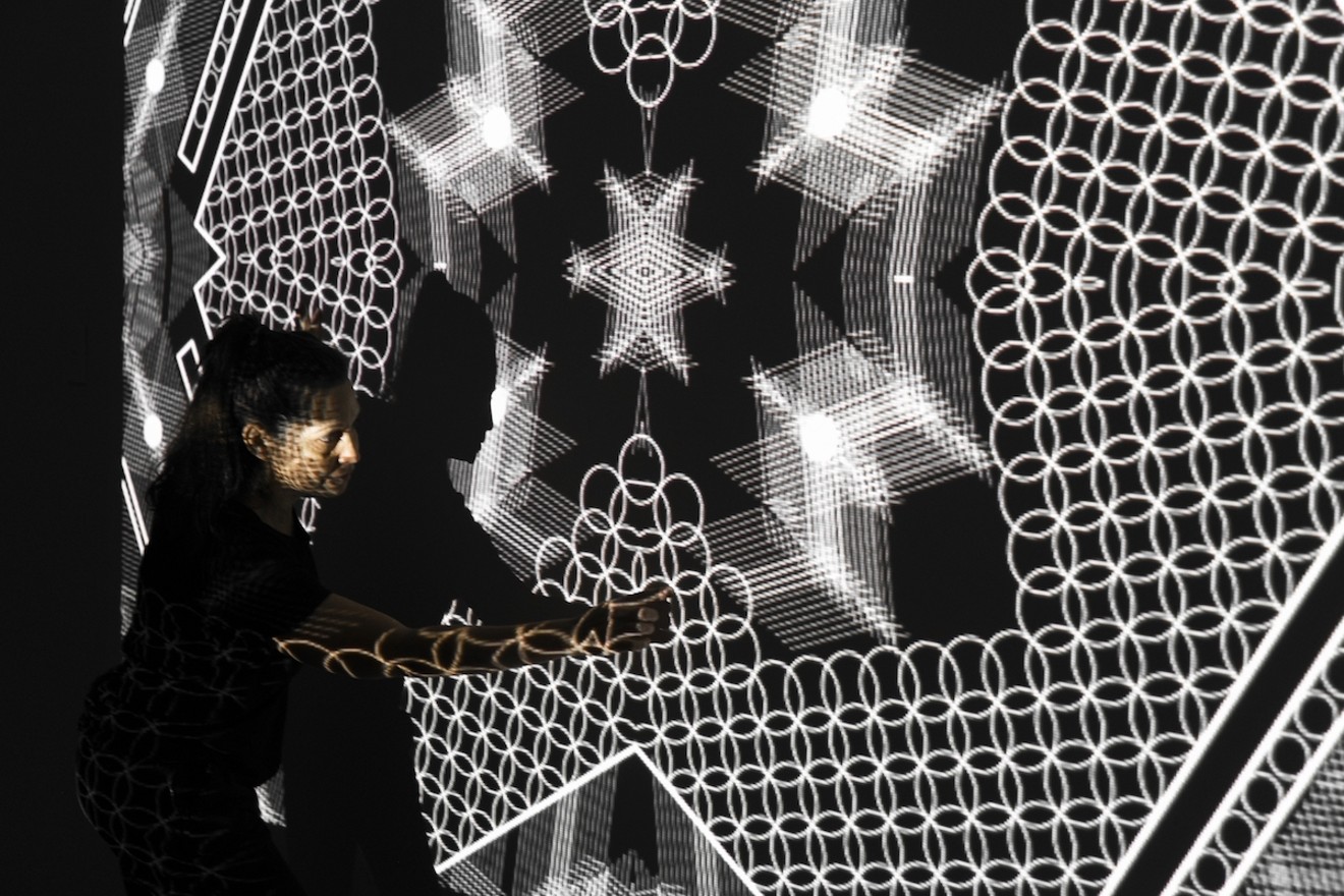 Tal Frank in the studio testing video projections in "Homeline."