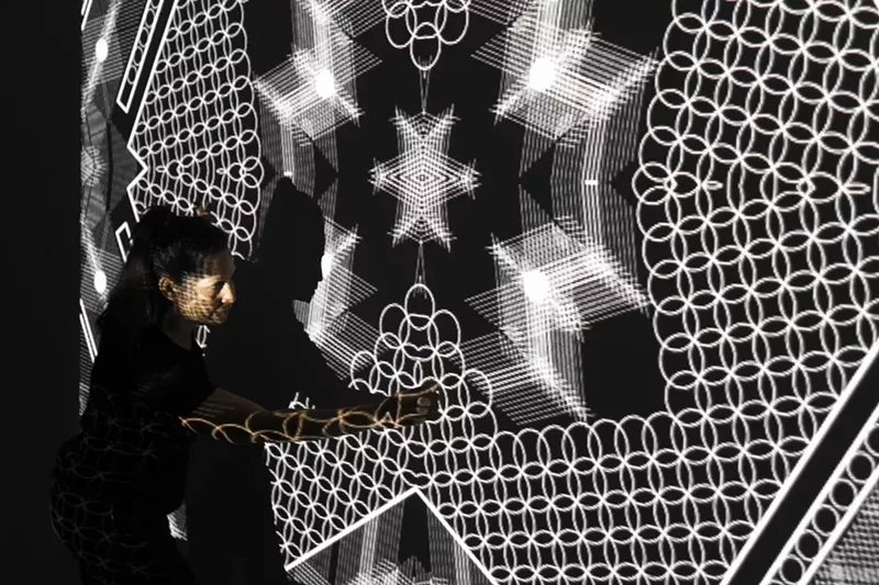 Image: Tal Frank in the studio testing video projections in "Homeline."
