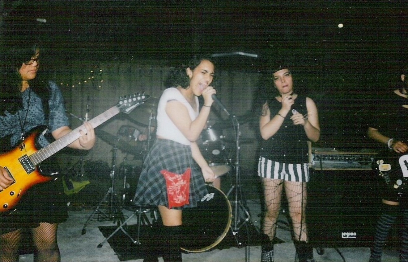 A Polaroid snapshot of the all-girl punk band Landica at a house show in 2014.